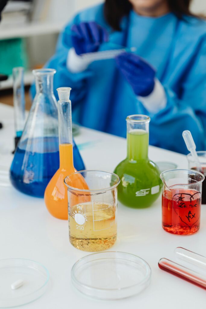 Vibrant laboratory setup with beakers, flasks, and test tubes, showcasing colorful chemical experiments.